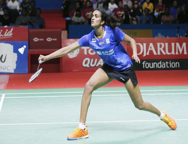 PV Sindhu of India competes against Akane Yamaguchi of Japan during their women's singles final match at Indonesia Open badminton championship at Istora Stadium in Jakarta, Indonesia. (Image Credit: AP/PTI)