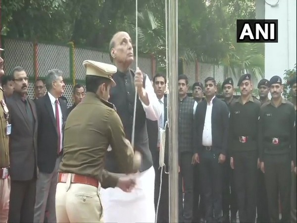 Defence Minister Rajnath Singh hoists national flag at his residence