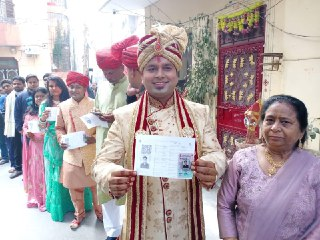 Groom, family stand in line to vote in Delhi polls