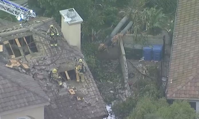 A small plane crashed into the backyard of a residential neighborhood in southern California killing two people.