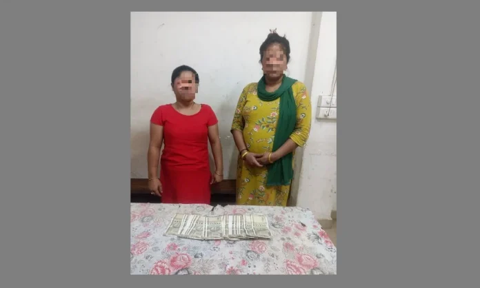 Dispur Police arrested two women who had robbed a youth of Rs 18,000 after brandishing a knife at him in Ganeshguri, Guwahati, on Wednesday night.